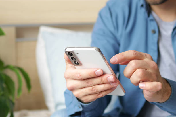 istock Man hands with smartphone. Lifestyle. Easy pay online banking using smartphone or digital device. Communication via app for sale in shop. Social media. 1475478740