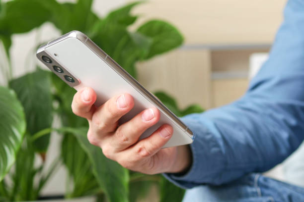 istock Male hands typing text message on mobile phone, social media concept 1475478741