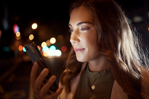 Woman, face or phone in night city, road or street for social media, taxi call or cab searching in London urban location. Student, tourist or person on mobile communication technology in dark travel