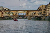 Ponte Vecchio seen from a boat on the Arno River in Florence