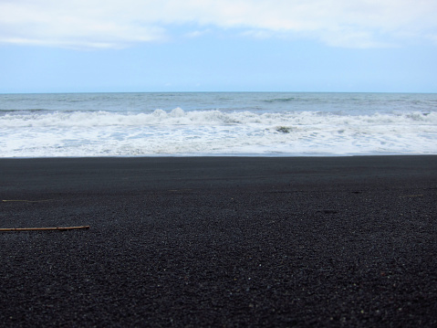 black sand beach at Bambang Beach in the south sea of ​​Indonesia's Java island