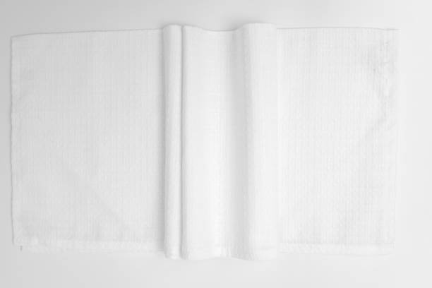 istock White textured cotton fabrics swatches on light background.Textile Mockup. Towel 1475485860