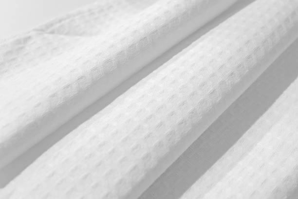 istock White textured cotton fabrics swatches on light background.Textile Mockup. Towel 1475485864