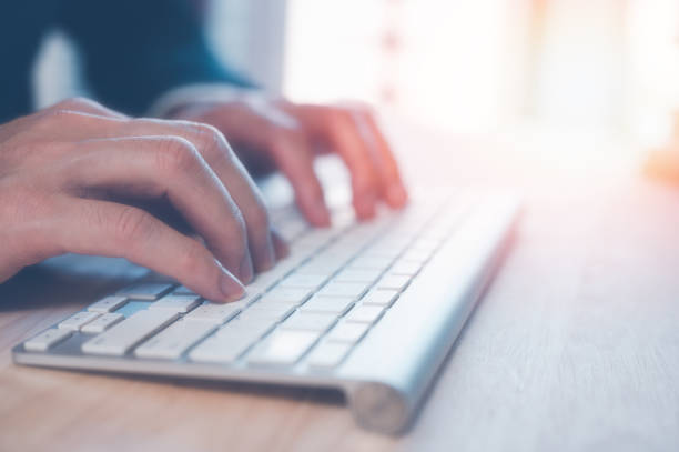 istock businessman typing on keyboard on office table, working space, working from home 1475487647