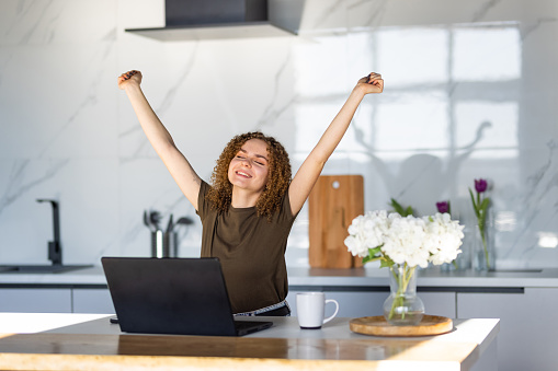 Young attractive woman hands up accounting with check credit analytic for mortgage payment.