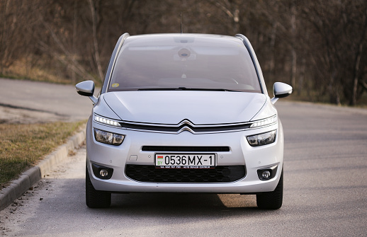 Belarus, Minsk -23.03.2023:Citroen C4 Grand Picasso II stopped on the road. This model is one of the most popular minivan vehicles in Europe.