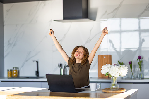 Young attractive woman hands up accounting with check credit analytic for mortgage payment.