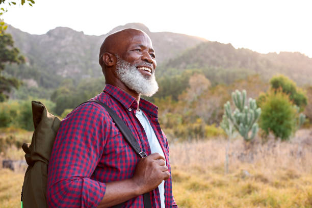 istock Portrait Of Active Senior Man With Backpack Going For Hike In Countryside 1475495434