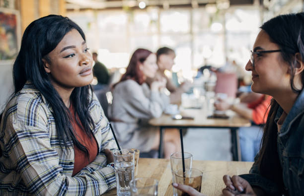 istock Women sitting in cafe 1475495439