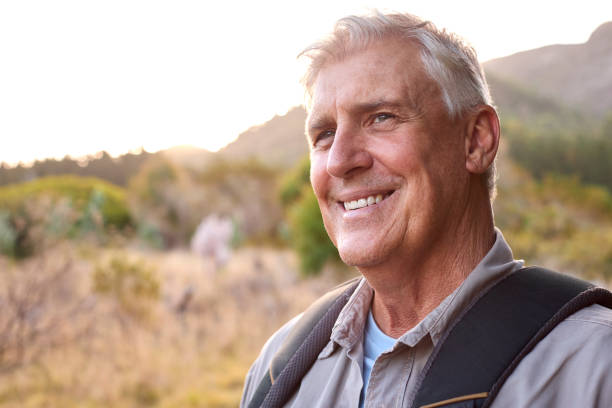 istock Portrait Of Active Senior Man With Backpack Going For Hike In Countryside 1475496181
