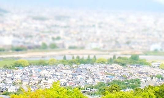 blur image of cityscape with bokeh in miniature effect for background usage.