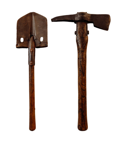 Old shovel and pickaxe for military camp isolated on white background.