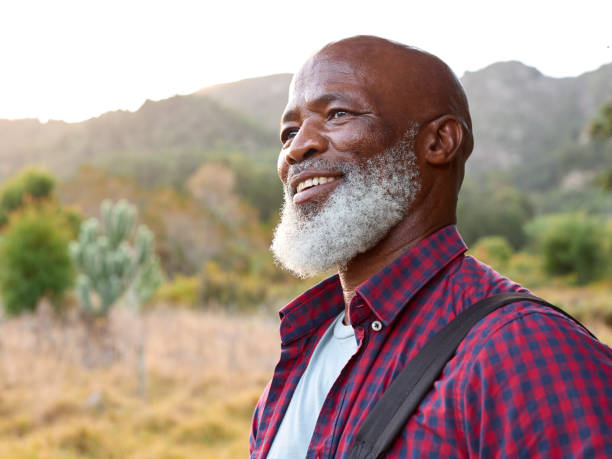 istock Portrait Of Active Senior Man With Backpack Going For Hike In Countryside 1475498490