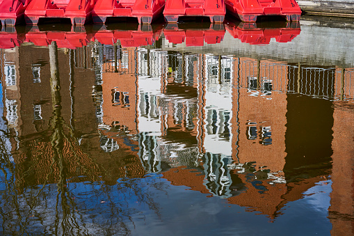 Red brick build house reflected in the stream \