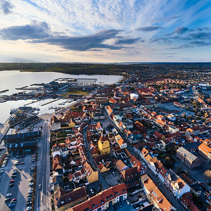 Old Danish town with middle cozy old houses. Aerial view of city center with detached church tower