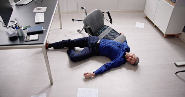 istock Faint Accident In Office. Fall From Chair 1475501675
