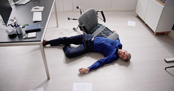 Faint Accident In Office. Fall From Chair At Workplace