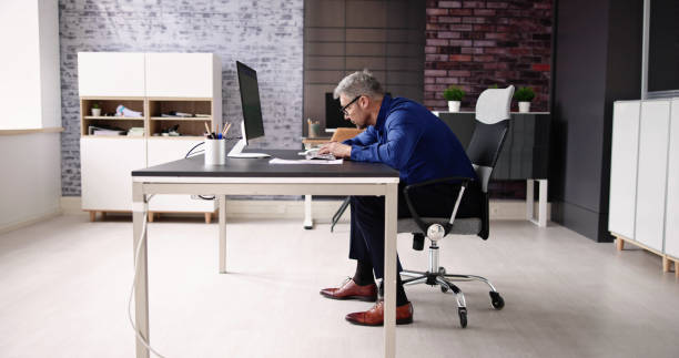 istock Bad Posture Sitting In Office Chair 1475503411