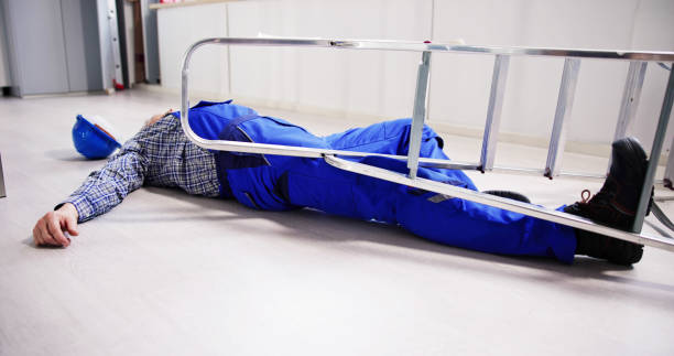 istock Unconscious Handyman Fallen From Ladder With Equipments Lying 1475503772