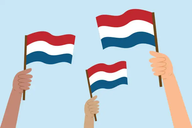 Vector illustration of Different hands holding Dutch flags. Flag of the Netherlands.