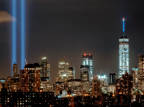 Lights shine in the place of the former World Trade Center as seen from Brooklyn, NY.