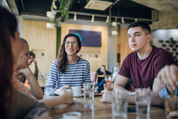 istock Friends sitting in cafe 1475517830