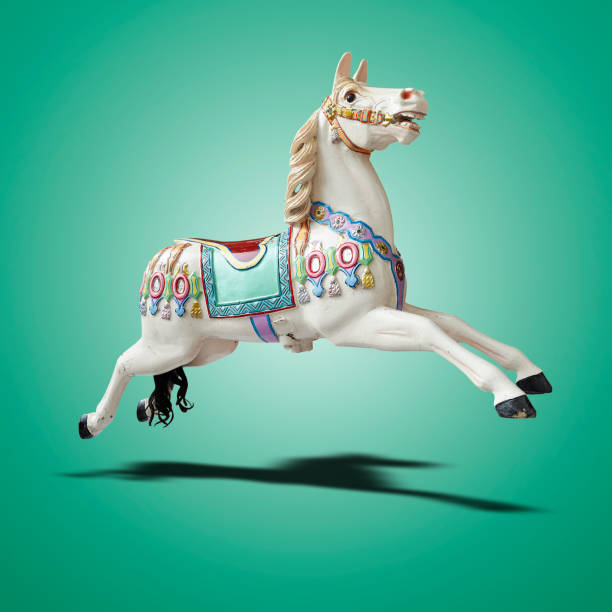 istock Floating classic carousel horse on green gradient 1475522472