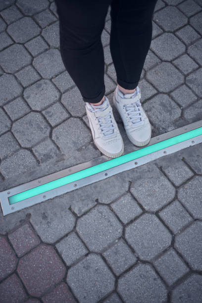 istock Integrated crosswalk stoplight for pedestrians in asphalt. 1475526985