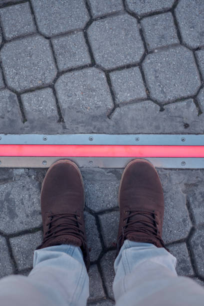 istock Integrated crosswalk stoplight for pedestrians in asphalt. 1475527003