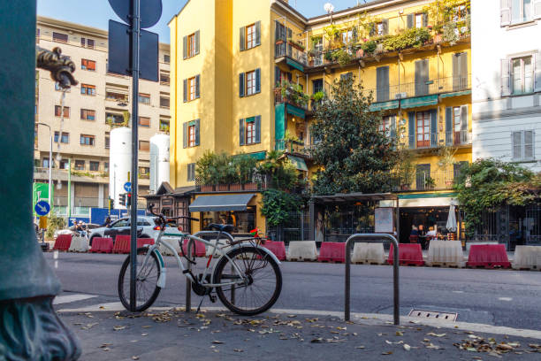 istock Milan street view: drinking fountain, bicycle, bright building facade 1475527942