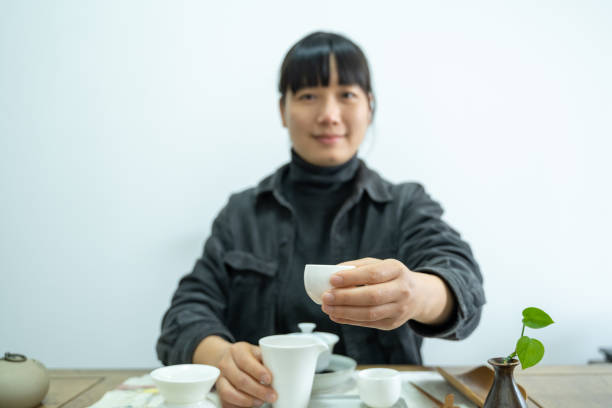 istock An Asian woman serving tea 1475528266