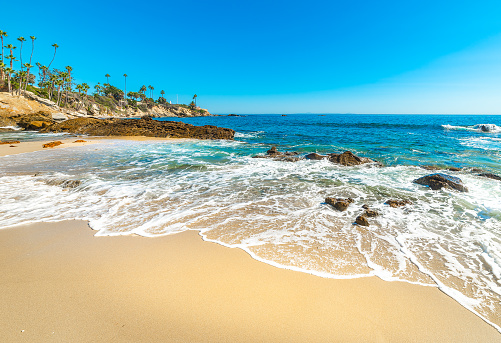 White sand and rocks in Laguna Beach shoreline. California, USA