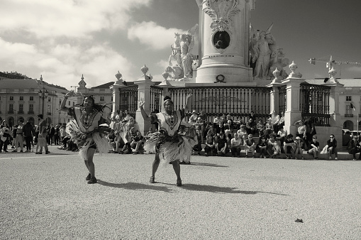 Lisbon, Portugal - May 21, 2022: A group of african dancers performs at the Praça do Comércio square in Lisbon downtown.