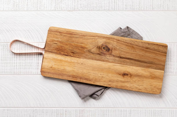 istock Wooden cutting board and kitchen towel 1475540379