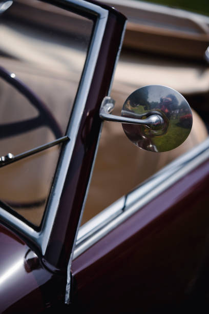 istock Round rear view mirror on a vintage car 1475541162