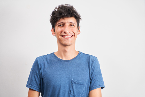 Portrait of a young man smiling with strabismus