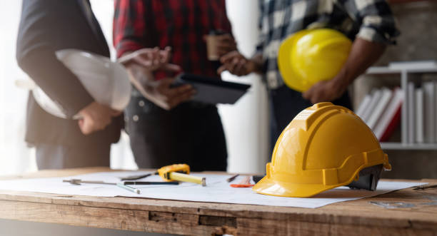 istock Team engineer man working with laptop and inspection  for architectural plan,sketching a construction project 1475546490