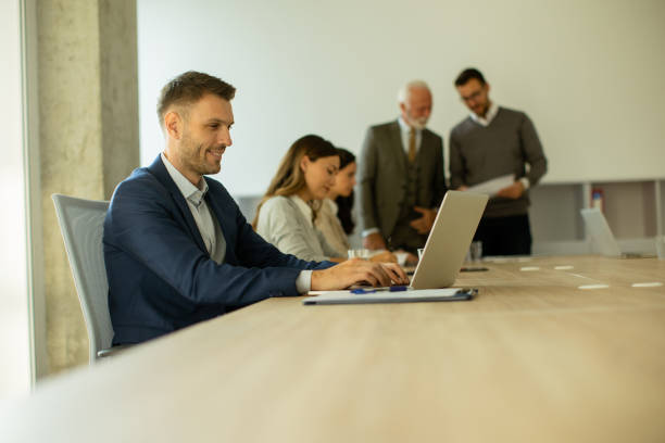istock Young business man using laptop computer in the office 1475549171