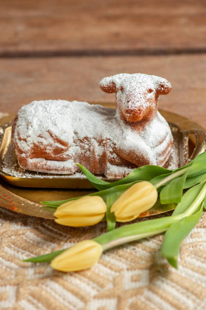 istock Easter Lamb cake with tulips in rustic kitchen for Easter celebrations 1475550441