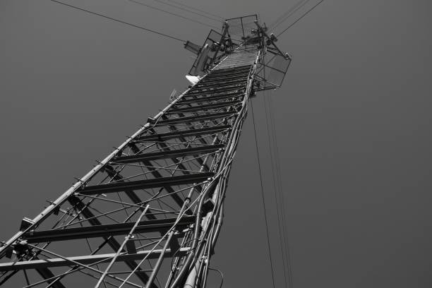 Radio, television broadcast or Cell cellular signal tower from underneath looking straight up into sky, horizontal frame