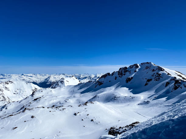 istock Alpine valley, snowy mountains in Switzerland. 1475551365