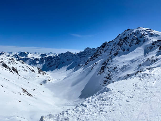 istock Alpine valley, snowy mountains in Switzerland. 1475551382