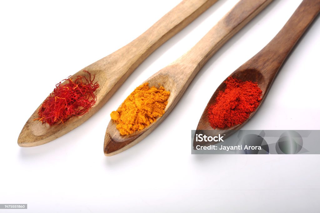 Indian Spices In Wooden Spoon Back Lit Stock Photo
