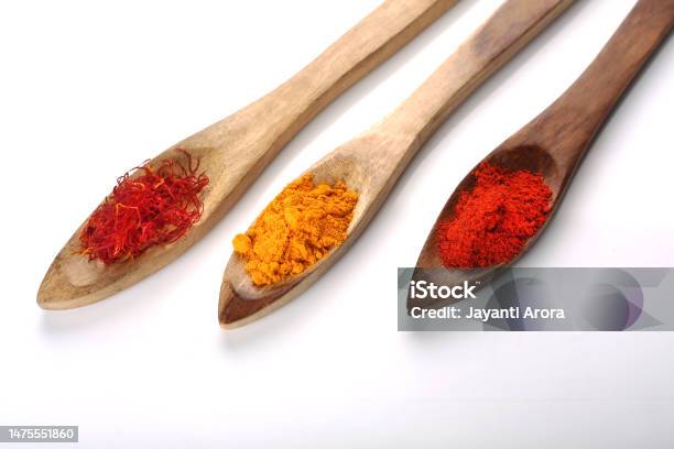 Indian Spices In Wooden Spoon Stock Photo - Download Image Now - Back Lit, Close-up, Color Image