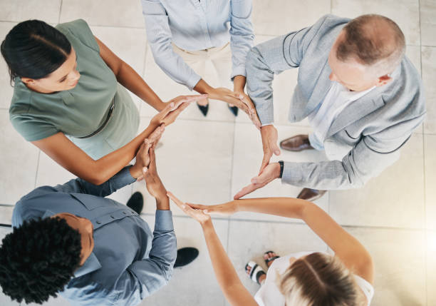 istock Top view, business people or circle hands in collaboration, diversity team building or financial growth support. Men, women or workers solidarity gesture, teamwork mission or finance goals motivation 1475551923