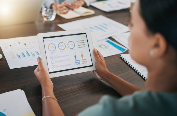 istock Digital tablet, meeting and business people with paperwork planning a project with data, graphs and statistics. Technology, documents and team working on a corporate company strategy in the workplace 1475551940