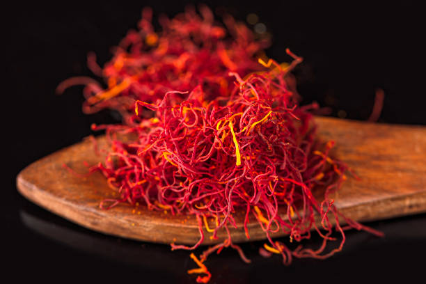 istock Red Saffron in Wooden Spoon 1475552880