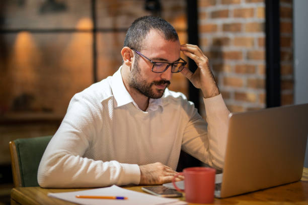 istock Headache, Migraine, Businessman with Glasses Working at Computer, Negative Emotions 1475556005