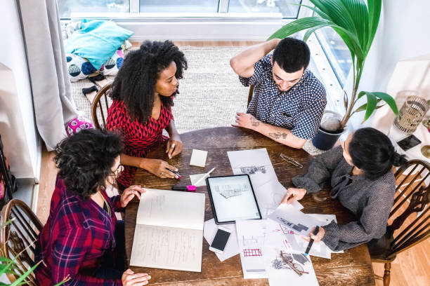 istock architects and customers planning together at desk 1475556150