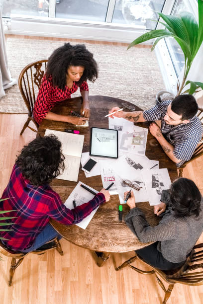 istock architects and customers planning together at desk 1475557138